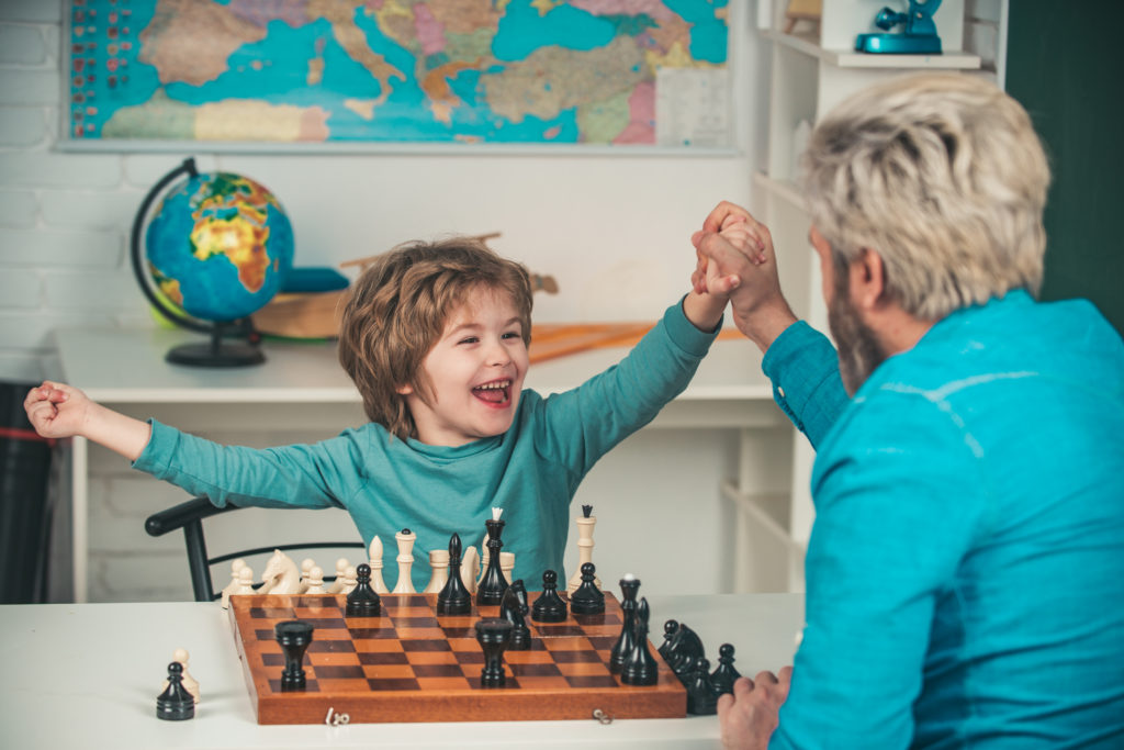 Sun and Dad Playing chess